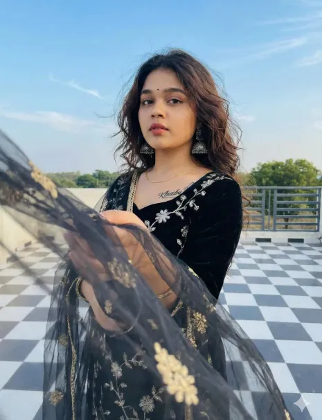 South Asian Woman in Velvet Kurta with Dupatta on Rooftop